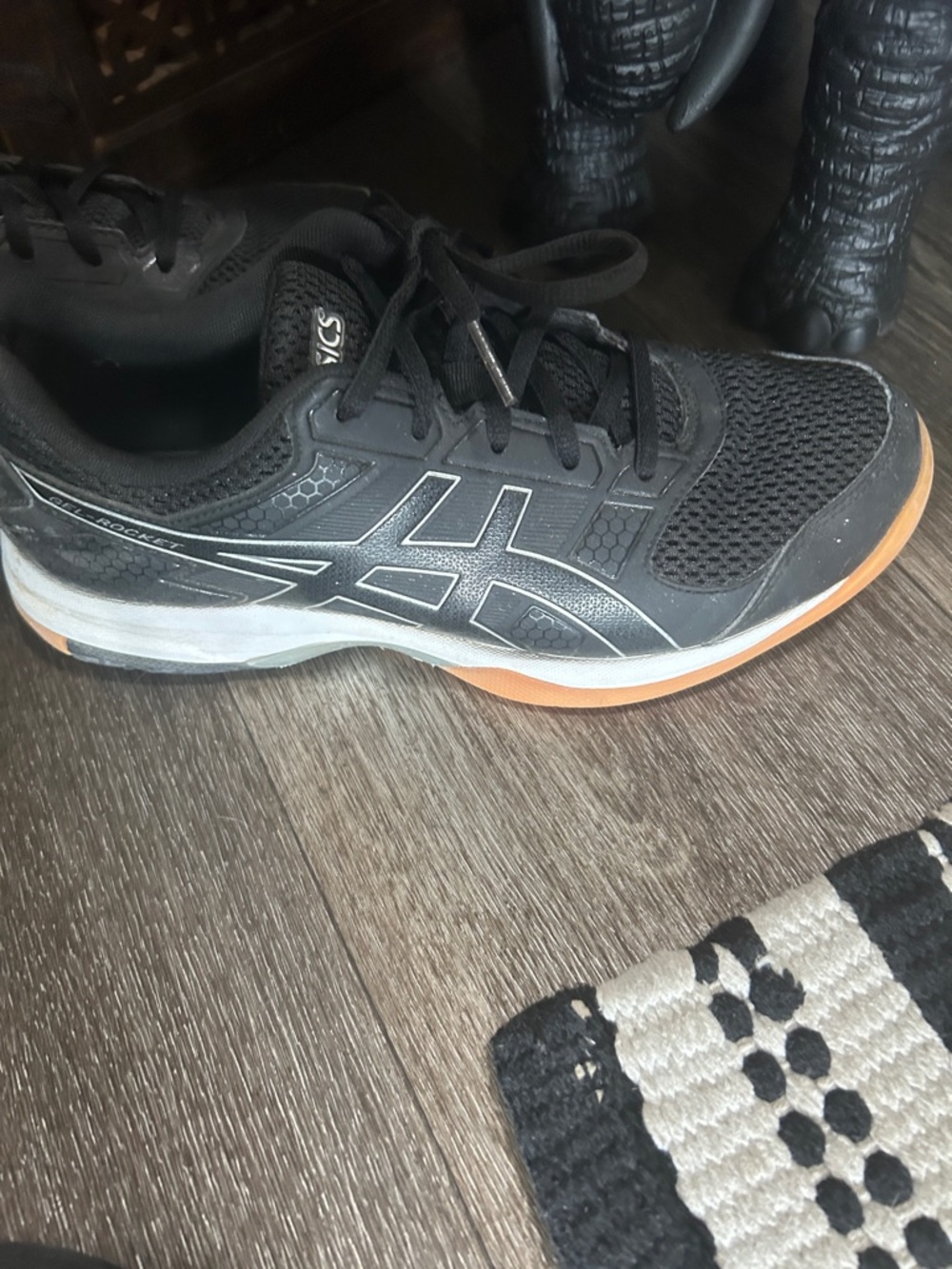 ASICS Unisex Black Athletic Shoes with Orange Accent